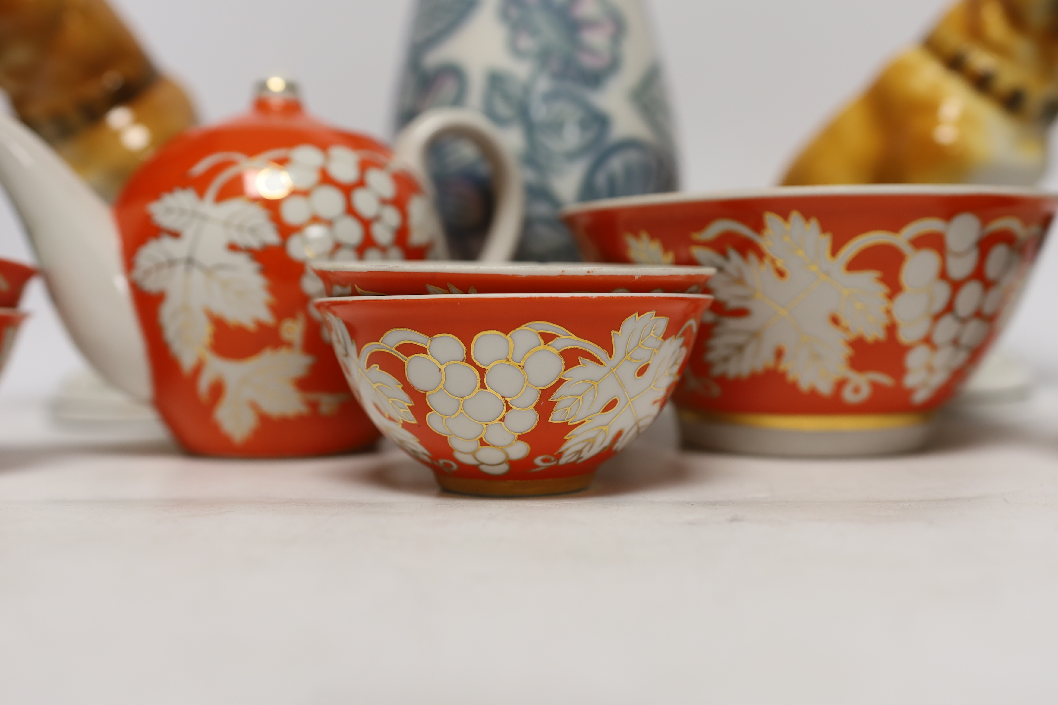 A pair of Russian porcelain models of French bulldogs, a part Chinese (Russian) tea set and a vase